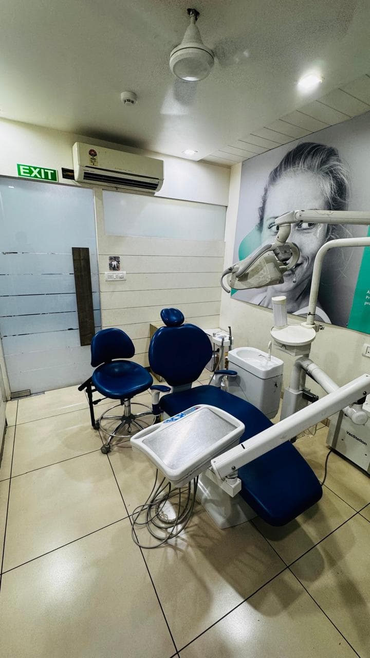 Private treatment room with smile mural
